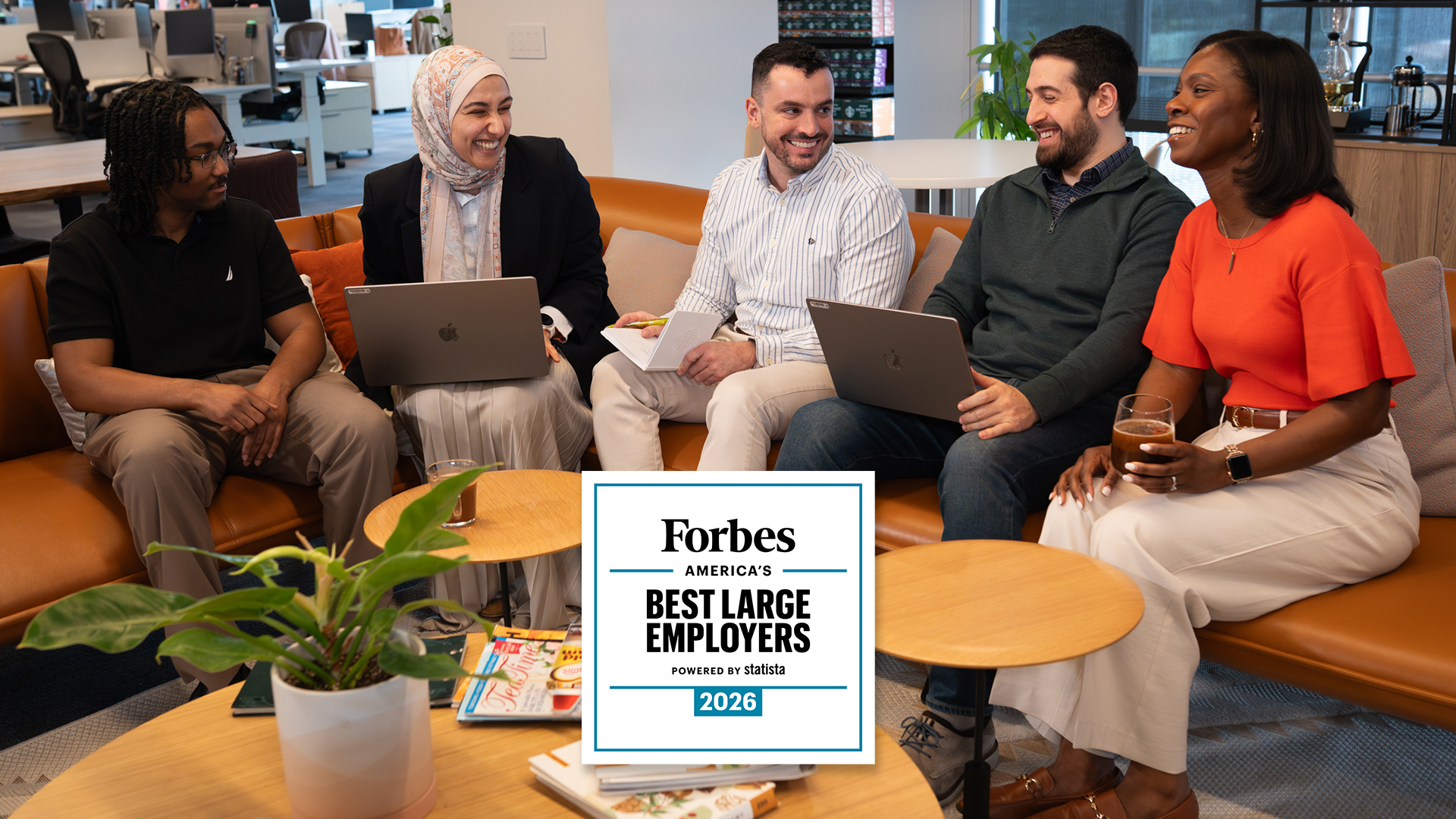 Employees working together on a couch