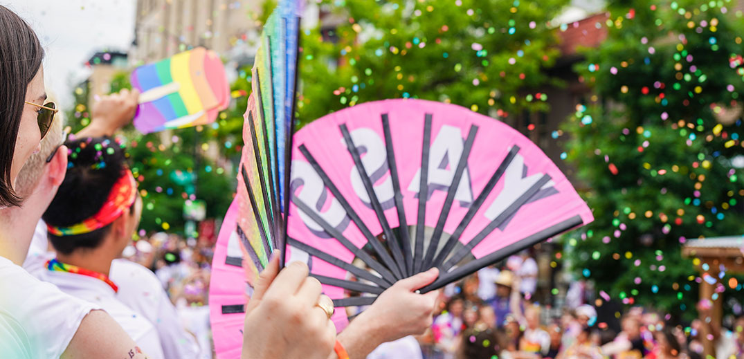 Nestle employees holding pride fans at 2022 DC Pride Parade