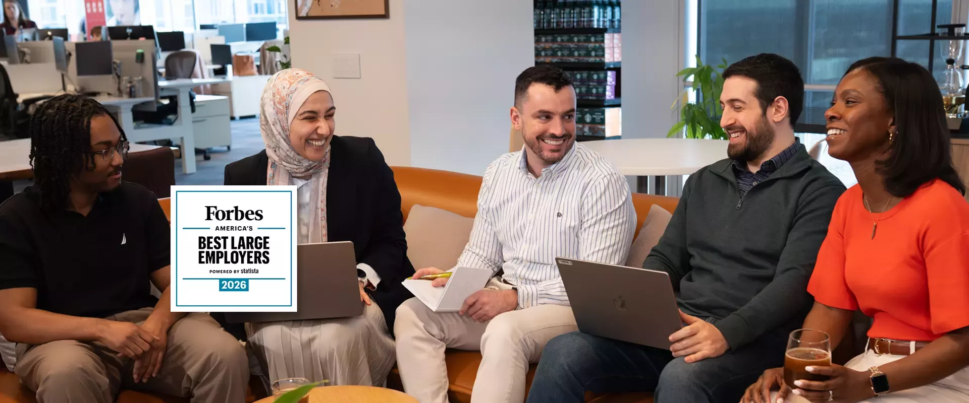 Employees working together on couch