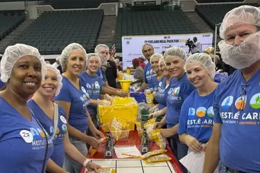 Employees packing meals
