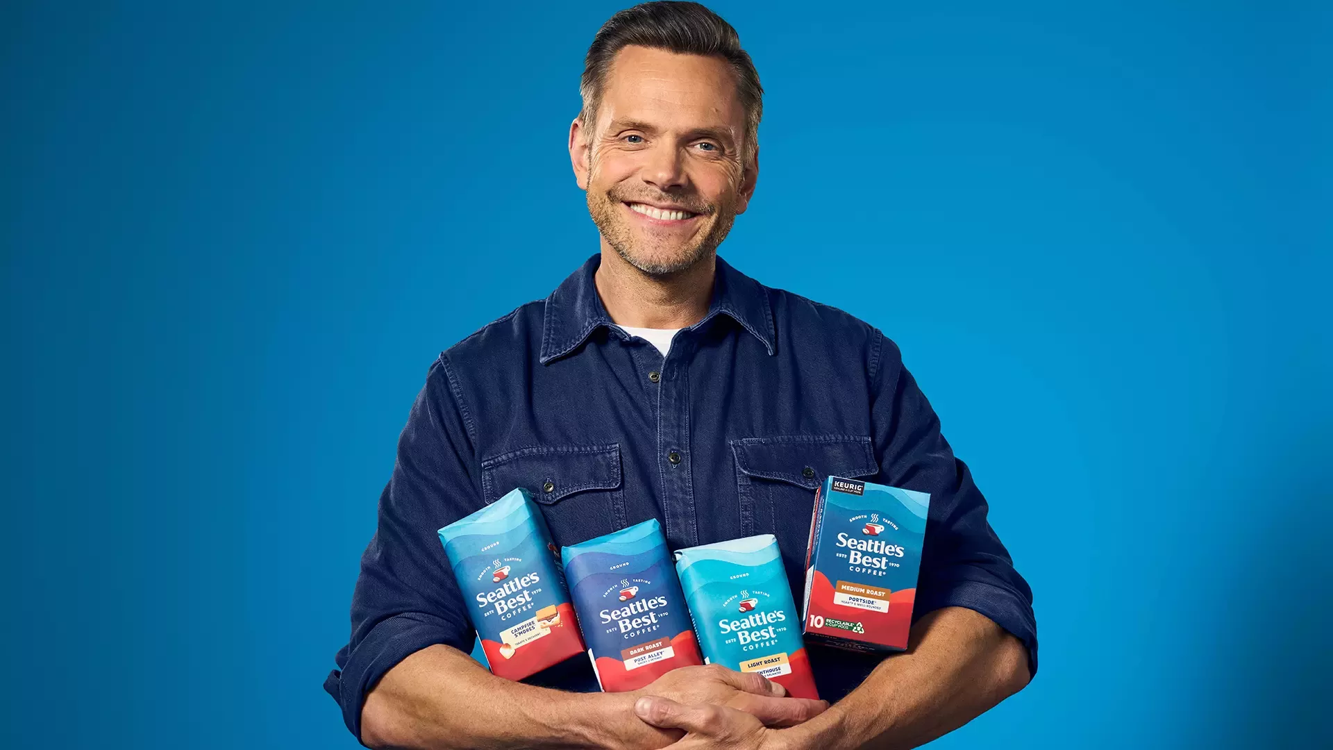 Man holding bags of coffee