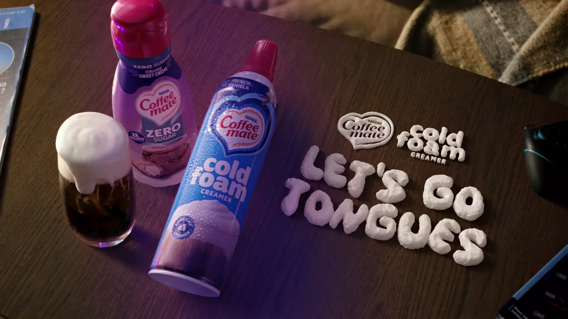 Coffee mate creamer and cold foam on a table with cold foam spelling out "Let's Go Tongues"