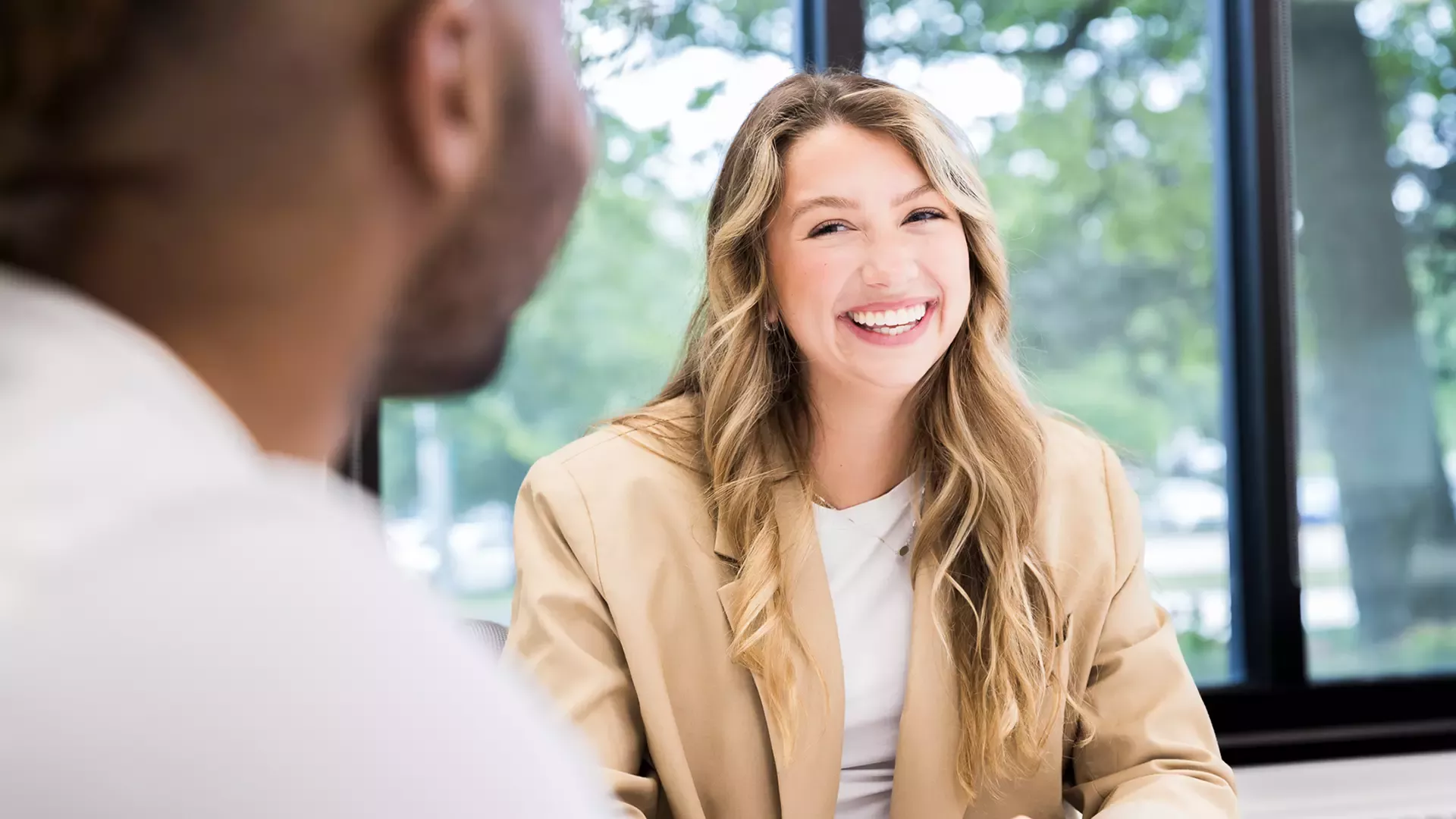 Woman smiling at desk