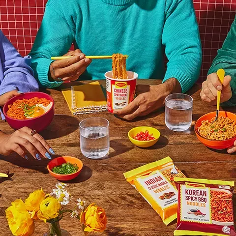 Group eating Maggi Noodles at table