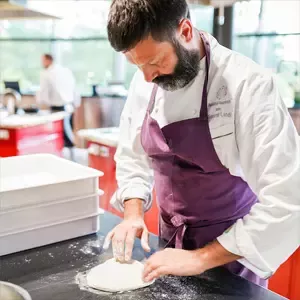 Baker preparing dough