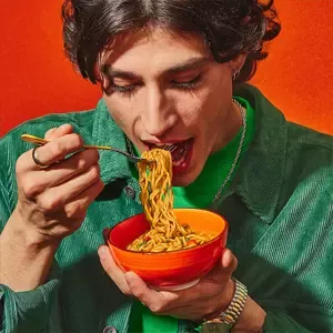 Person eating noodles