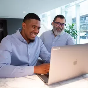 Colleagues working on laptop