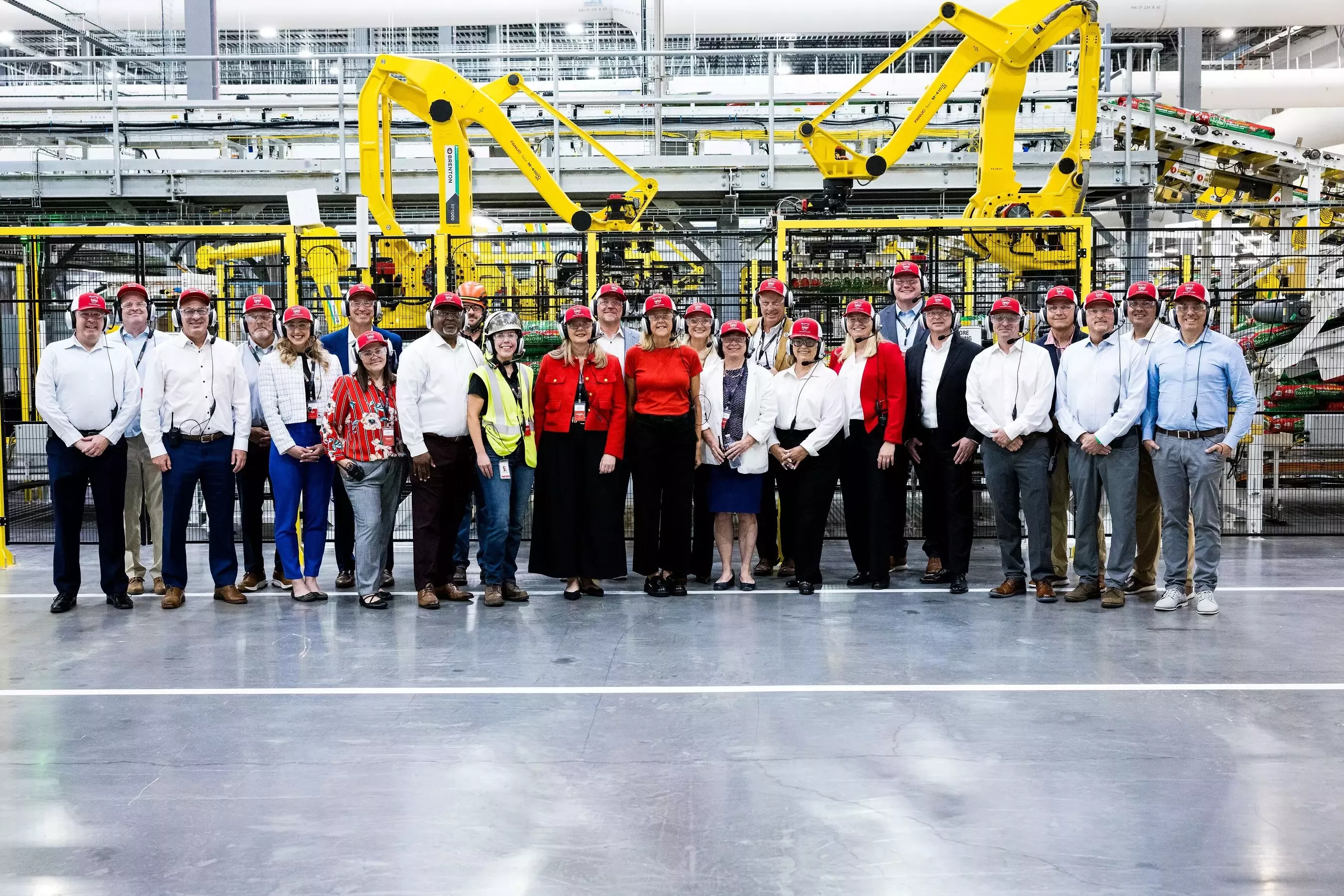 Purina leaders, employees and elected officials at factory