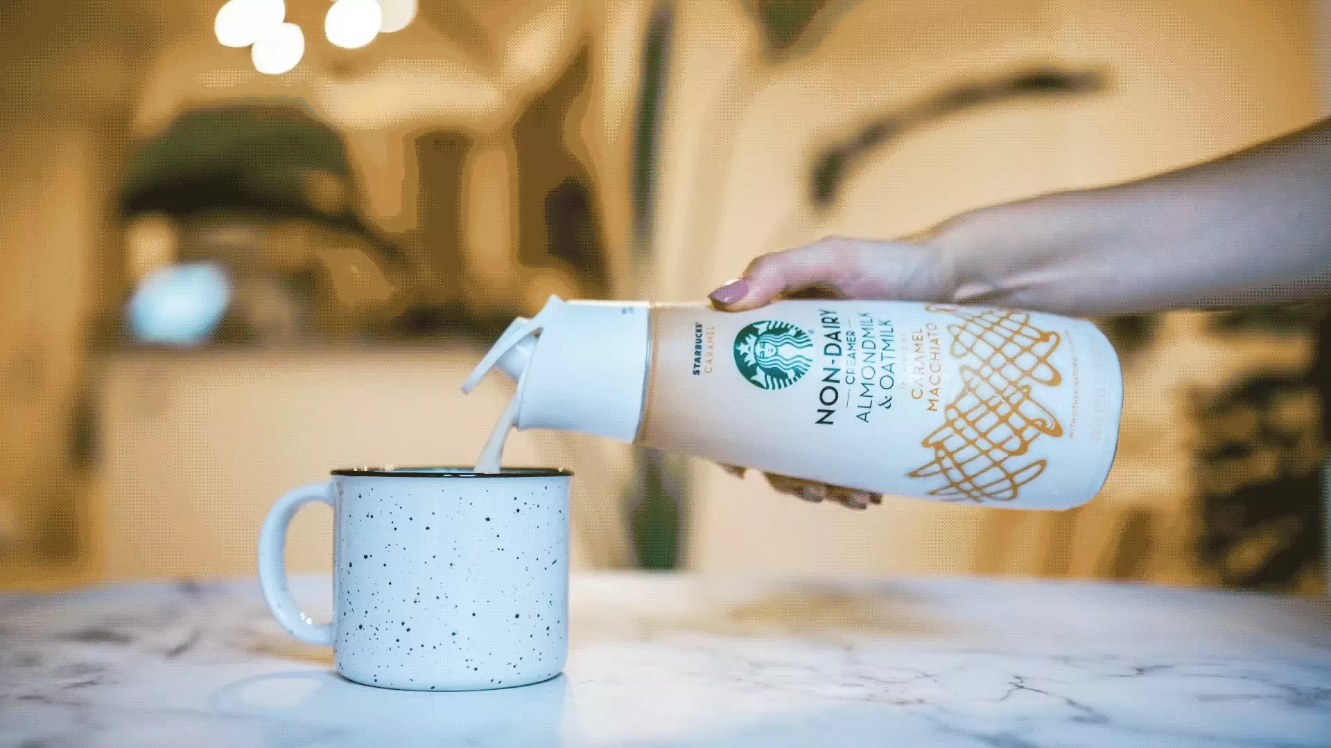 Coffee mate pouring into cup