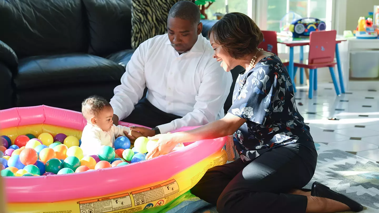 Parents playing with child